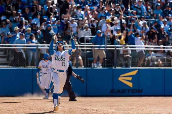 No. 6–seed UCLA softball catcher Sharlize Palacios celebrates after a big hit during a game.