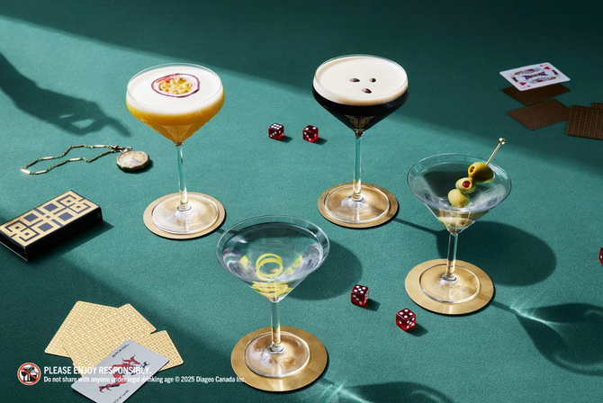 Cocktails displayed on a poker table with cards and dice