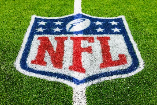 A detailed view of a NFL shield logo paint of the field during a 2024 preseason game between the Los Angeles Rams and the Houston Texans.