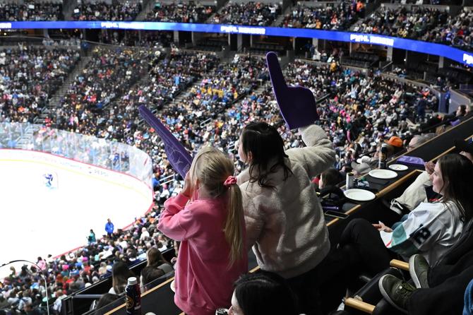 Hockey fans cheer during the PWHL Takeover Tour hockey game at Ball Arena in Denver, Colorado on January 12, 2025.