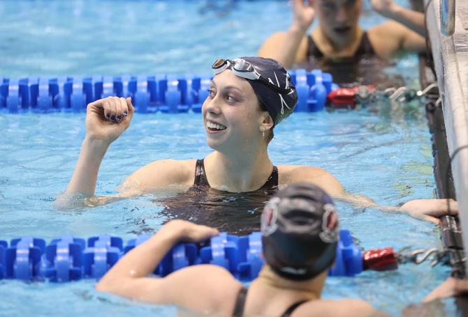 No. 1 Virginia women’s swimming junior Gretchen Walsh smiles from her lane after a race.