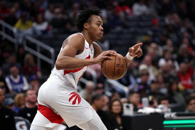 Scottie Barnes #4 of the Toronto Raptors dribbles upcourt during the second half of a game.