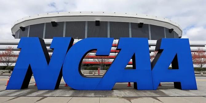 An NCAA sign stands outside a stadium.