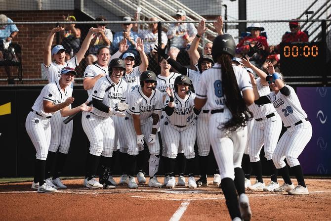 Team Warren celebrating a home run at home plate