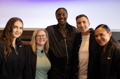 Nike Well Collective Trainer Kirsty Godso, Founder of the Center for Healing and Justice Through Sport (CHJS) Megan Bartlett, WNBA Player Sylvia Fowles, Co-founder of ICOACHKIDS Sergio Lara-Bercial, and Nike Chief Social & Community Impact Officer Vanessa Garcia-Brito pose for a photo.