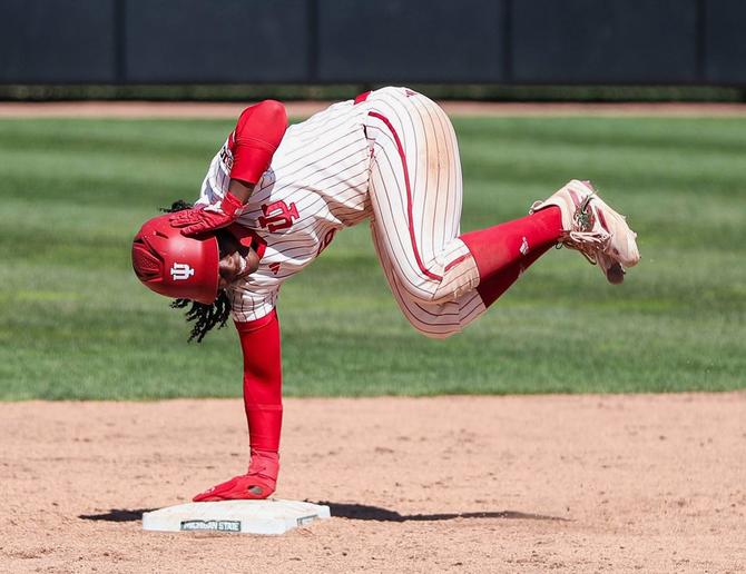 Indiana softball junior Brianna Copeland strikes a sideways celly on second base earlier this season.