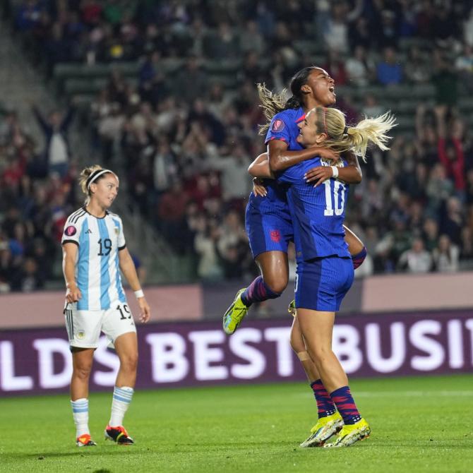 Jaedyn Shaw and Lindsey Horan hug and celebrate after a goal