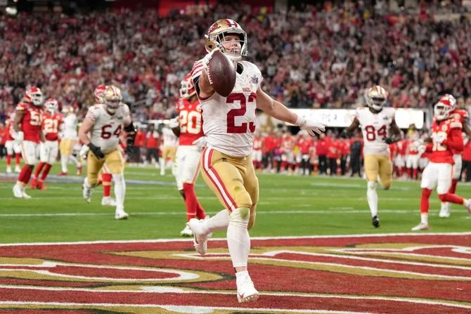 San Francisco 49ers running back Christian McCaffrey scores a touchdown