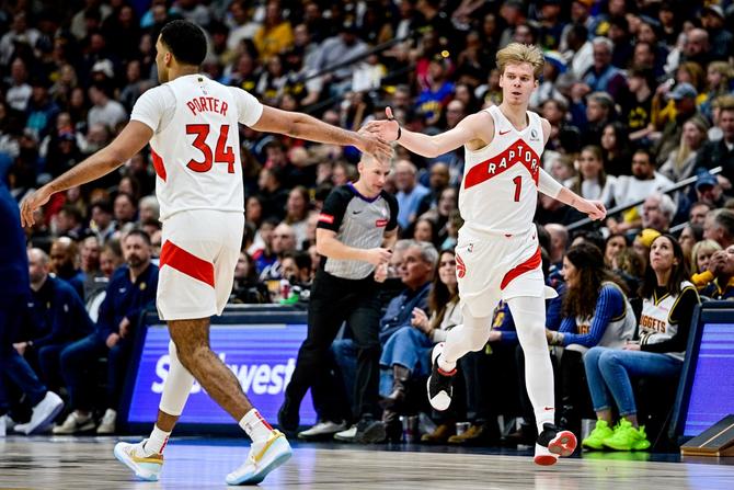 Gradey Dick #1 of the Toronto Raptors celebrates after a three-point basket in the first half against the Denver Nuggets