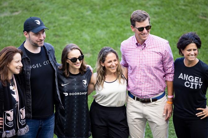 Kara Nortman, managing partner of Upfront Ventures and founder of Angel City FC; Alexis Ohanian, leading investor for Angel City FC; actress Natalie Portman and founder of Angel City FC; former NFL New York Giants quarterback Eli Manning and part of the Gotham FC ownership group; and Julie Urman, founder of Angel City FC, pose on the pitch before the National Women's Soccer League match between NJ/NY Gotham FC and Angel City FC at Red Bull Arena on August 28, 2022 in Harrison, New Jersey.