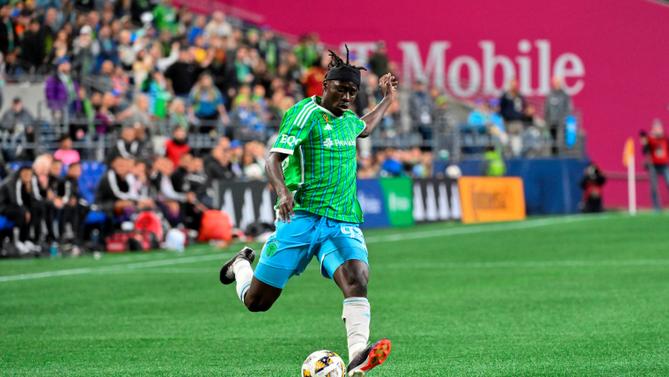 A soccer player kicking a ball