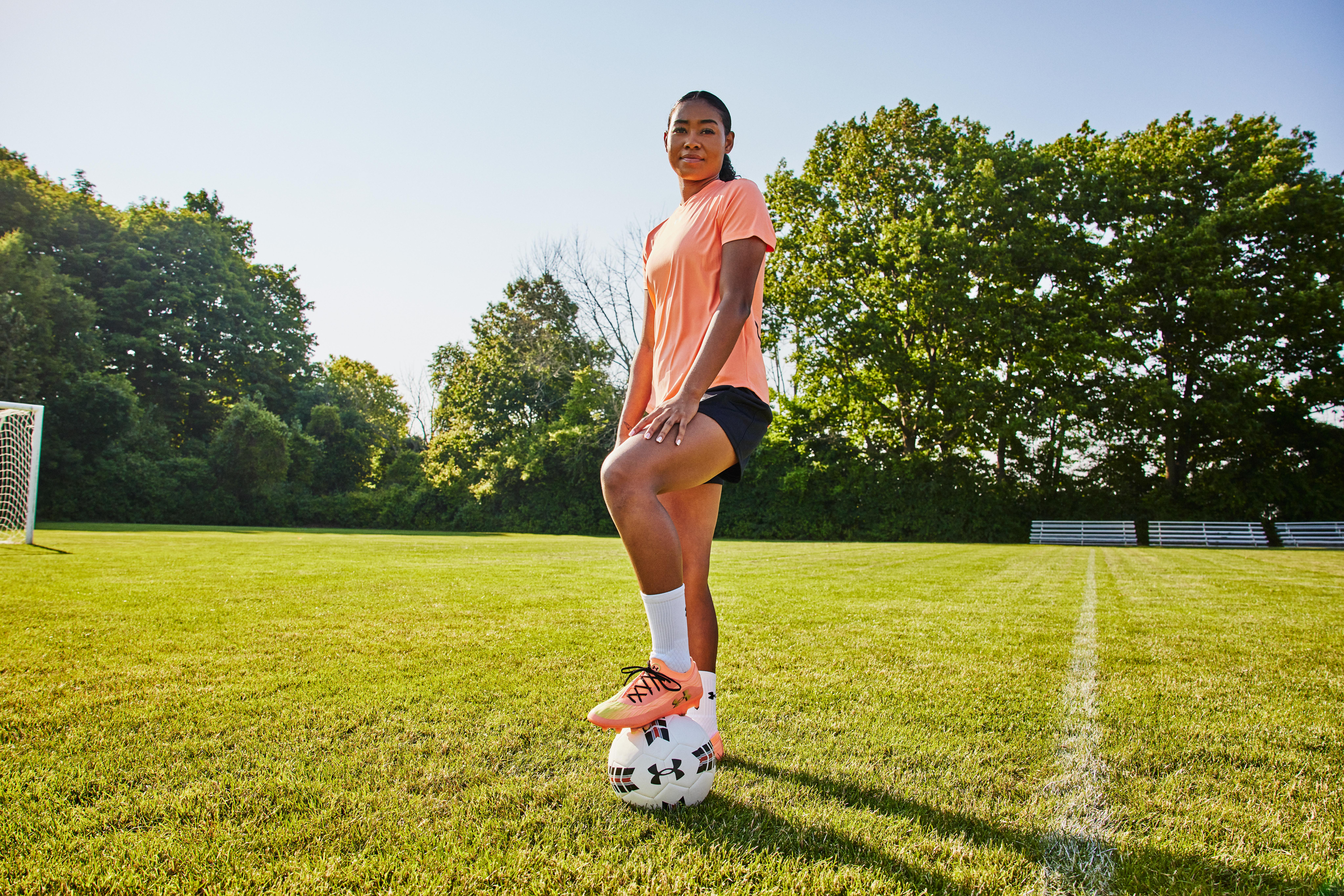 Canadian soccer player Jayde Riviere stepping on a soccer ball