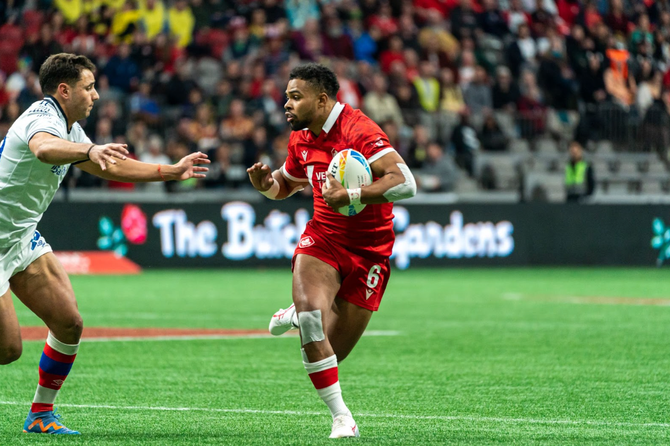 A rugby player carrying a ball