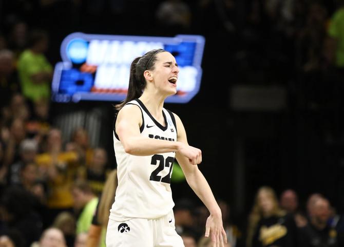Guard Caitlin Clark #22 of the Iowa Hawkeyes celebrates after drawing a foul late in the second half against the West Virginia Mountaineers during their second round match-up in the 2024 NCAA Division 1 Women's Basketball Championship at Carver-Hawkeye Arena on March 25, 2024 in Iowa City, Iowa.