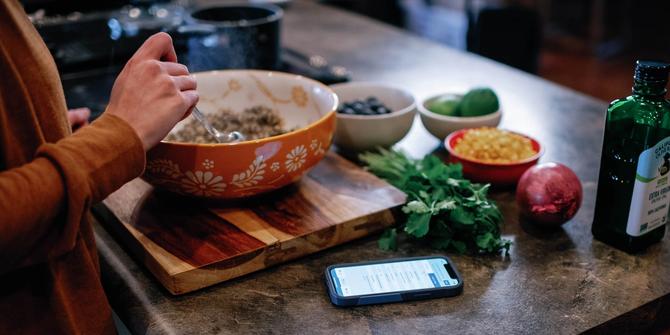 A person preparing a meal in a kitchen