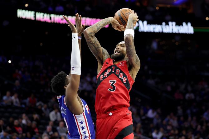 Toronto Raptor Brandon Ingram shoots the ball over a defender.