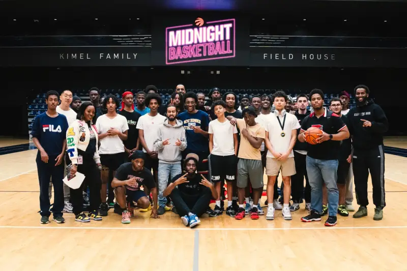 A group of people posing for a picture at a gym