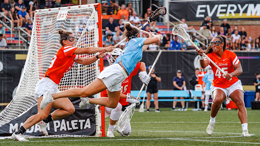 Athletes Unlimited lacrosse players compete in a match.