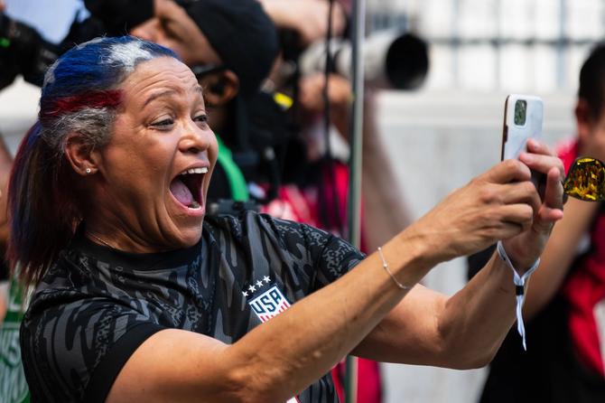 1999 FIFA Women's World Cup winner Saskia Webber takes a photo of her teammates before a match between the United States and Mexico at Red Bull Arena on July 13, 2024 in Harrison, New Jersey.