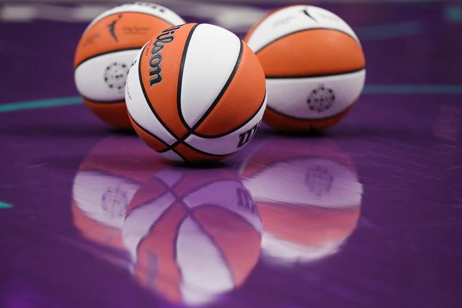 WNBA basketballs line the court