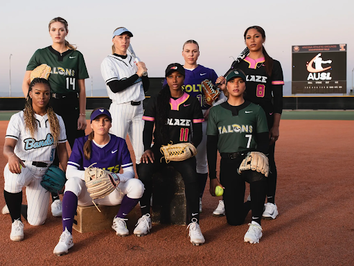 AUSL players pose together in uniform on softball field.