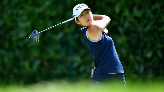Andrea Lee looks on after a swing.