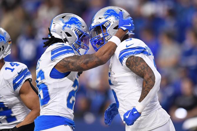 Lions running backs Jahmyr Gibbs and David Montgomery celebrate a touchdown