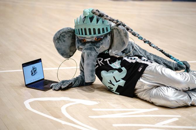 Ellie the elephant designing her Sabrina 2s on the basketball court