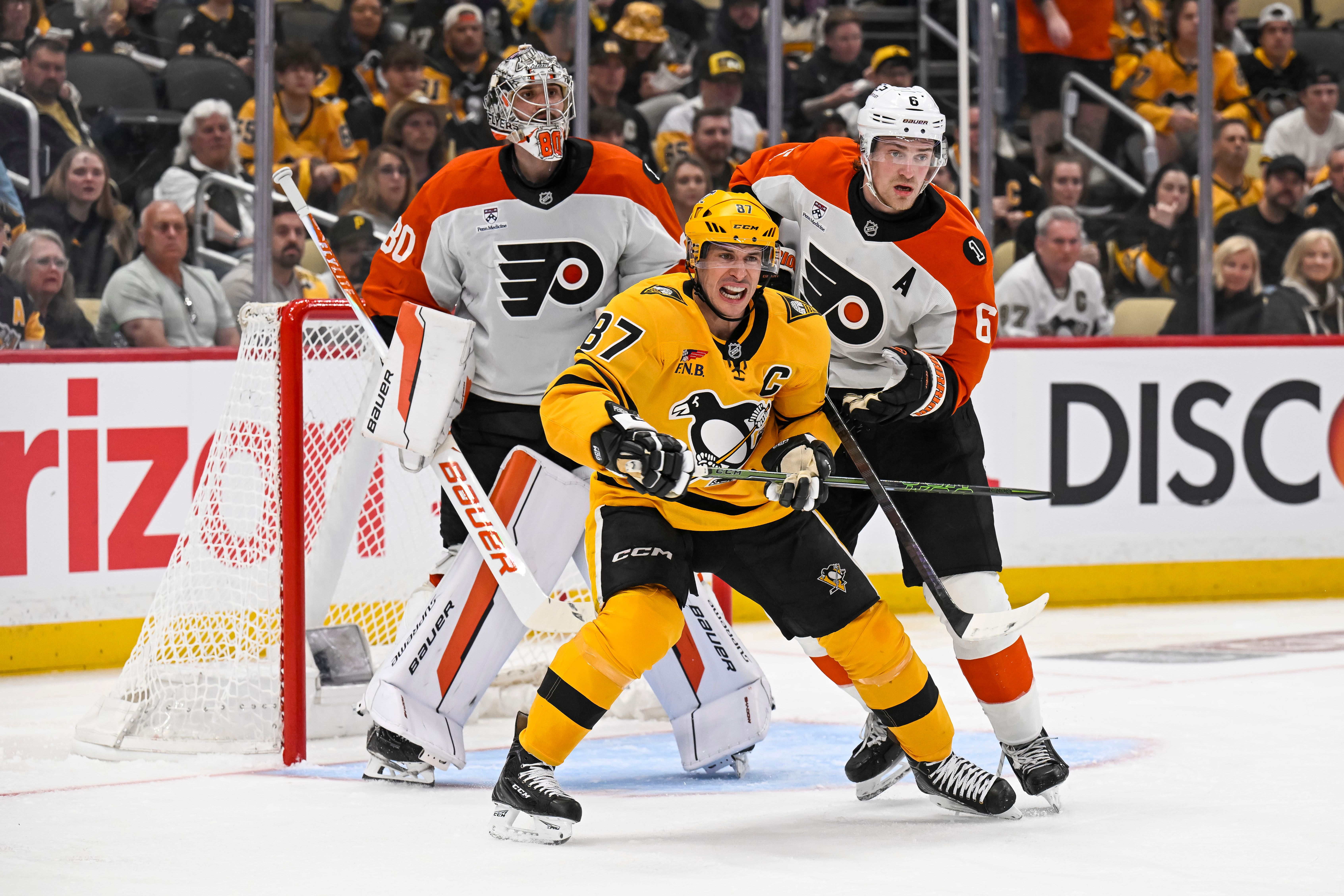 Pittsburgh Penguin Sidney Crosby battles for position in front of the net.