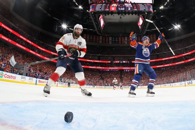 Ryan Nugent-Hopkins #93 of the Edmonton Oilers celebrates a goal by Steven Lorentz #18 against Aaron Ekblad #5 and the Florida Panthers in Game Six of the 2024 NHL Stanley Cup Final