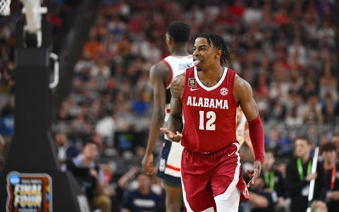 Latrell Wrightsell Jr. #12 of the Alabama Crimson Tide celebrates during the first half in the NCAA Men’s Basketball Tournament Final Four semifinal game against the Connecticut Huskies at State Farm Stadium on April 06, 2024 in Glendale, Arizona.