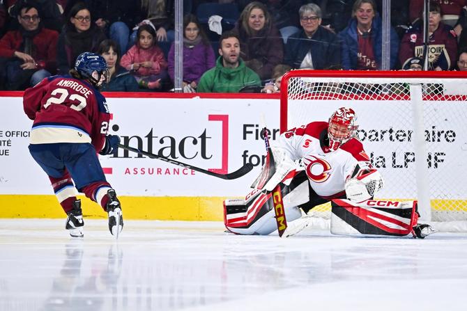 Goaltender Emerance Maschmeyer #38 of the Ottawa Charge gloves the puck on a shot.