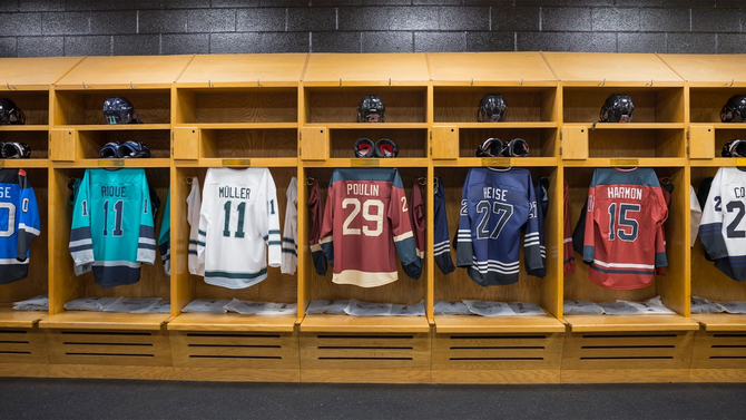 Jerseys of PWHL players hanging in their lockers