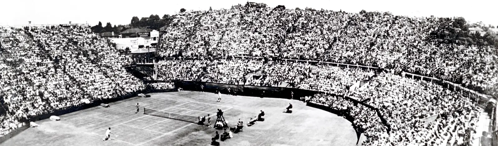 Aerial view of crowded stands at Kooyong Stadium in 1953. 