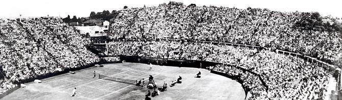 Aerial view of crowded stands at Kooyong Stadium in 1953.