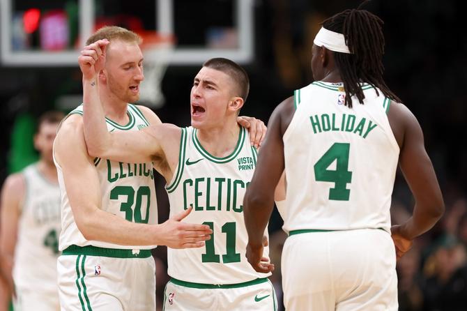 Payton Pritchard #11 of the Boston Celtics reacts to a three point shot during the third quarter against the Cleveland Cavaliers in Game One of the Eastern Conference Second Round Playoffs
