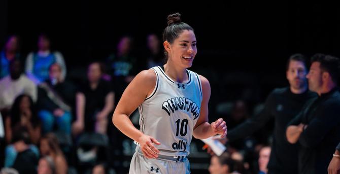 Kelsey Plum smiles on the court.