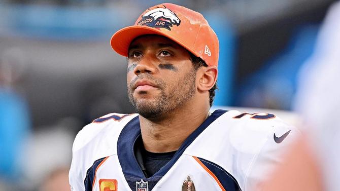 Denver Broncos quarterback Russell Wilson looking dejected.