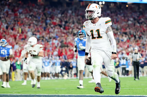 Miami quarterback Carson Beck runs in the game-winning touchdown.