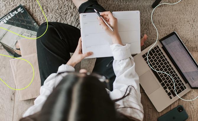 A girl writing in her planner