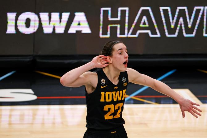 Caitlin Clark asking the crowd to cheer louder during a game