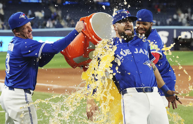 Nathan Lukes gets a Gatorade shower after defeating the San Diego Padres