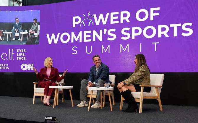Three people talking at the Power of Women's Sports Summit