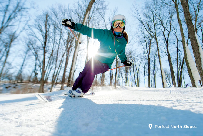 A person skiing on the Perfect North Slopes
