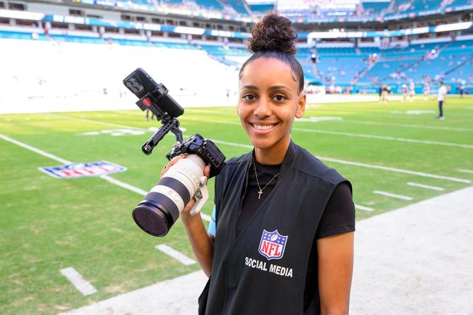 An NFL photographer smiling
