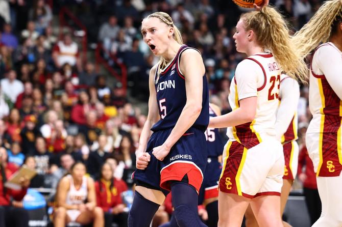 UConn women’s basketball star Paige Bueckers celebrates after scoring during the Huskies’ Elite Eight win over USC.
