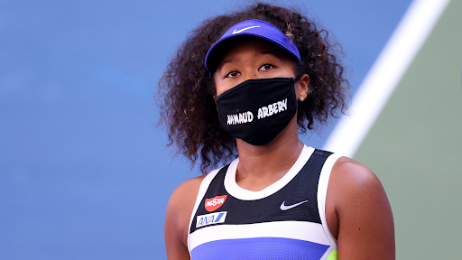 Naomi Osaka of Japan wears a protective face mask with the name Ahmaud Arbery stenciled on it after winning her women’s singles third-round match against Marta Kostyuk of the Ukraine on Day 5 of the 2020 US Open on Sept. 4.