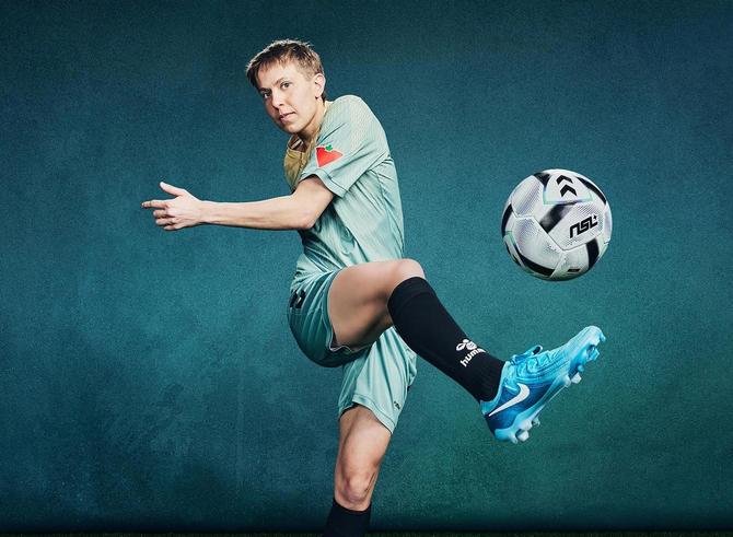 Quinn kicking a soccer ball