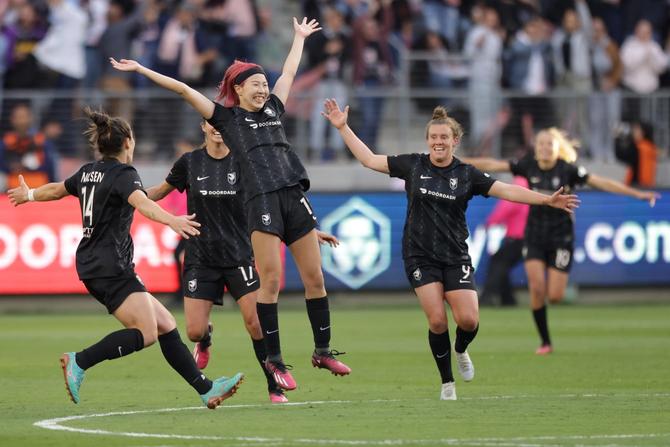 Jun Endo #18 of Angel City FC reacts with teammates after scoring a goal in the first half of a game against NJ/NY Gotham FC at BMO Stadium on March 26, 2023 in Los Angeles, California. The goal was later overturned.