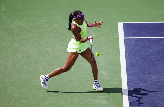 Coco Gauff hitting a tennis ball